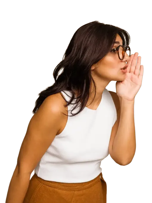 A woman wearing glasses is whispering.