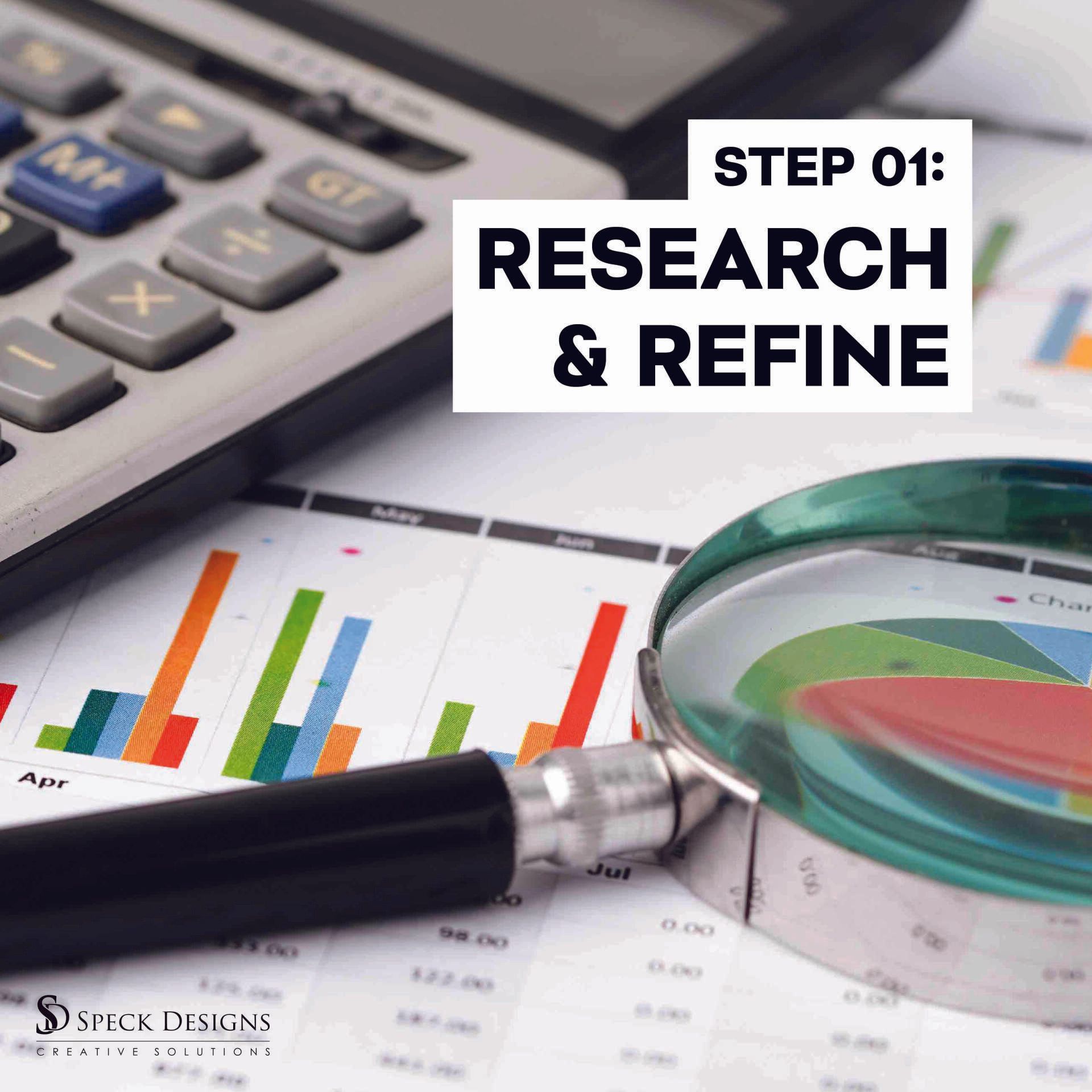 A magnifying glass sits on top of a graph next to a calculator