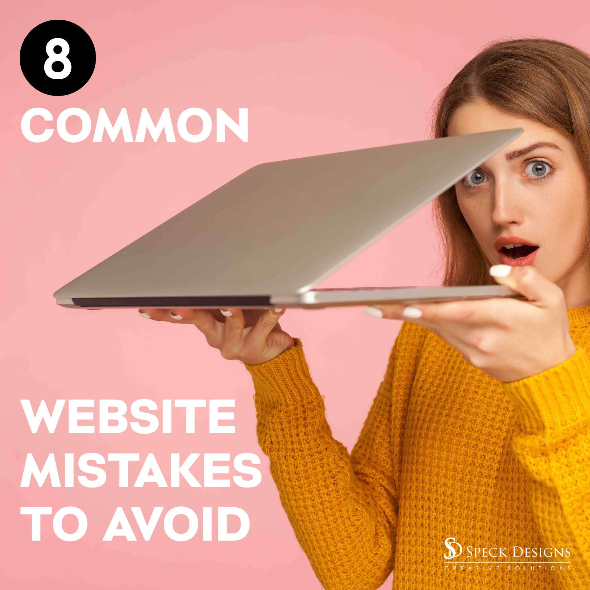 A woman in a yellow sweater is holding a laptop in front of her face.