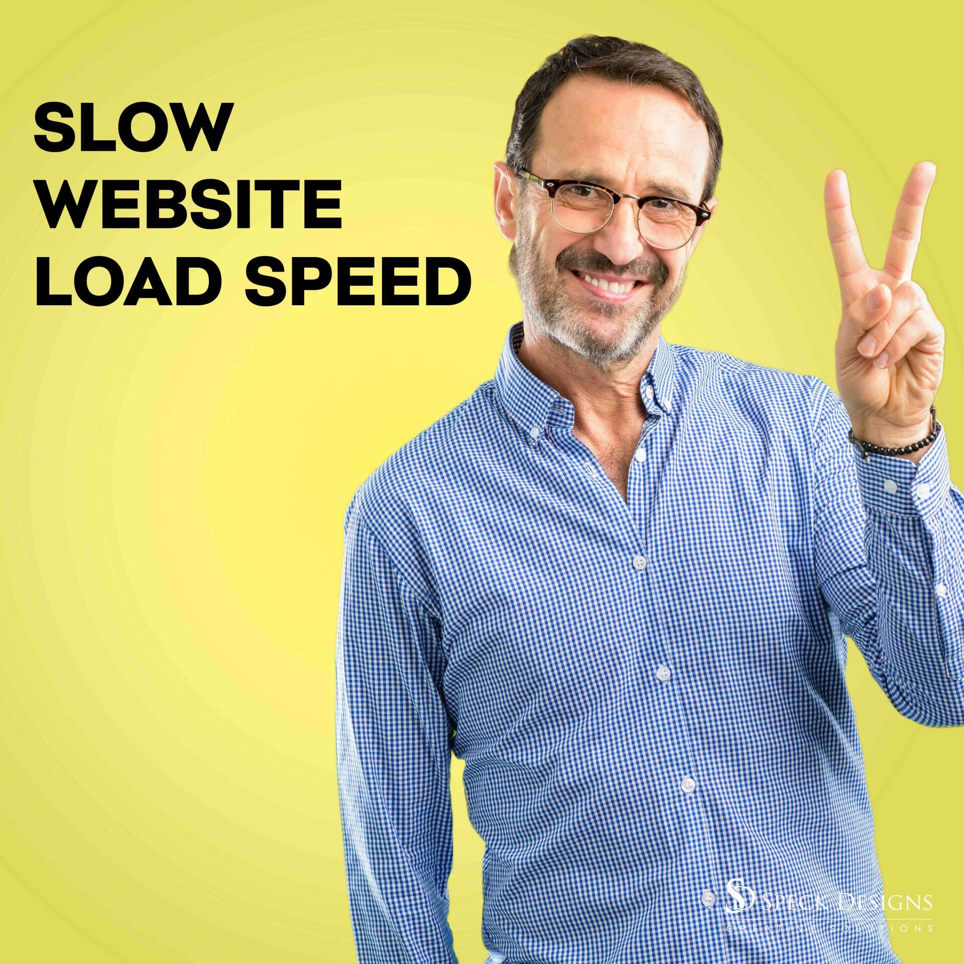 A man in a blue shirt is giving a peace sign.