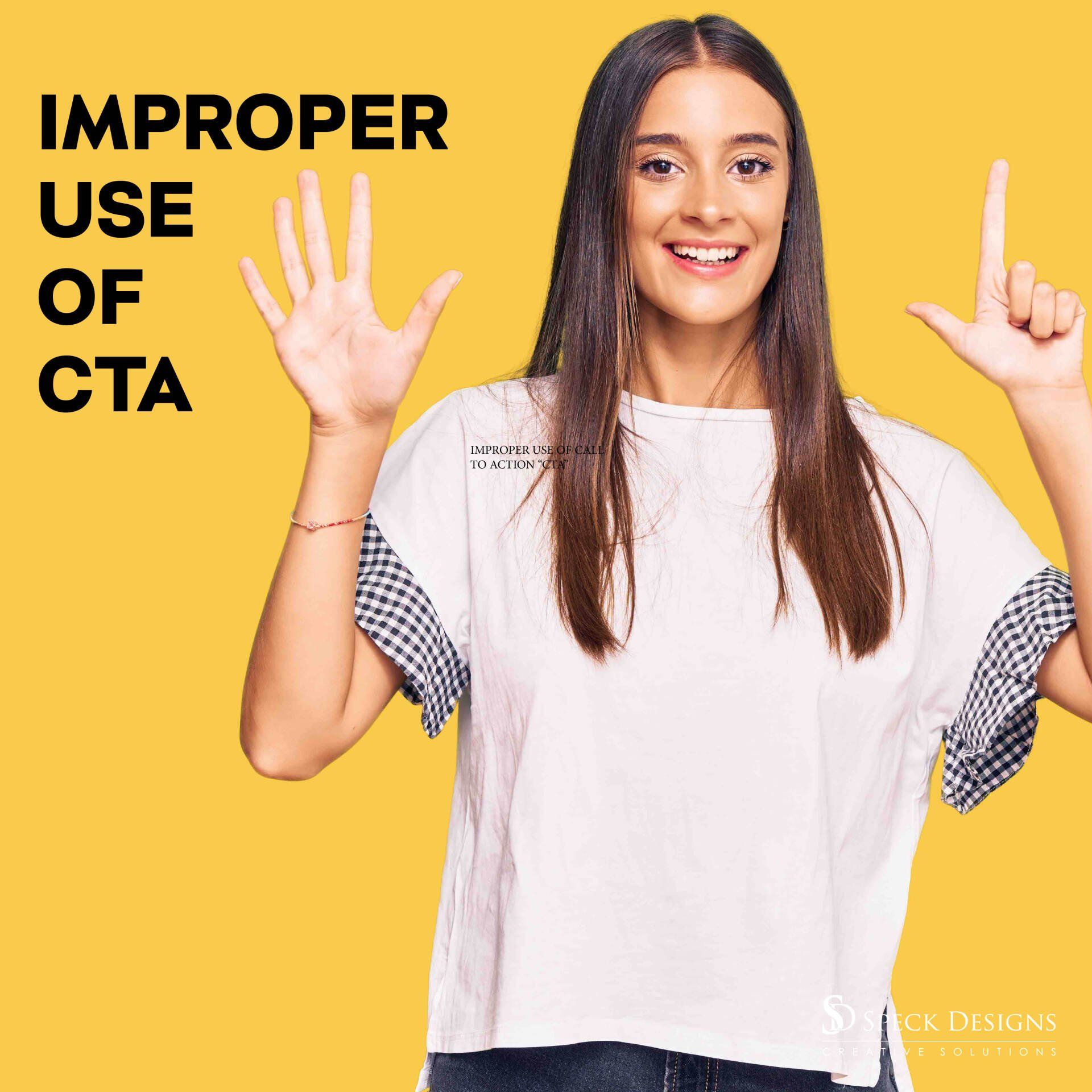 A woman in a white shirt is making a sign with her hands.