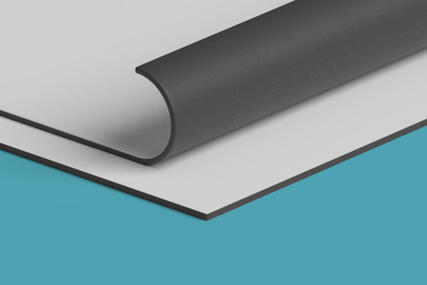 A close up of a piece of paper on a blue surface.