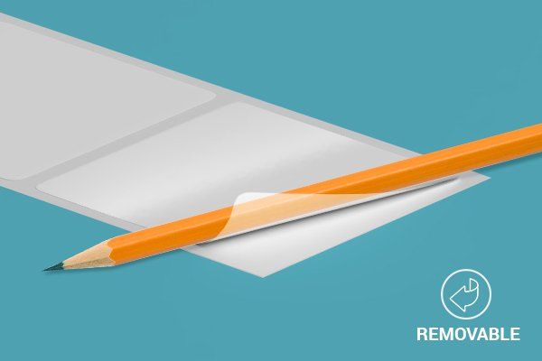 A pencil is sticking out of a piece of paper.