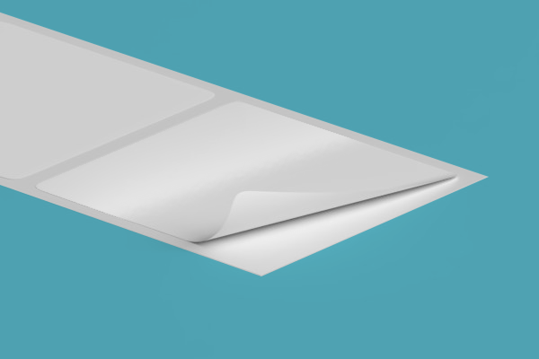 A piece of white paper is sitting on top of a blue surface.