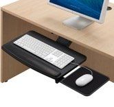 Black keyboard tray with a white keyboard and mouse under a desk with a monitor.