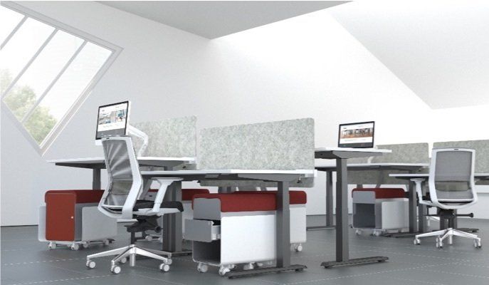 Modern office with sit-stand desks, ergonomic chairs, and cubicle dividers. White, gray, and red tones. Angled window.