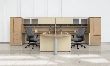 Office cubicle with desks, chairs, overhead storage, and a neutral color scheme.