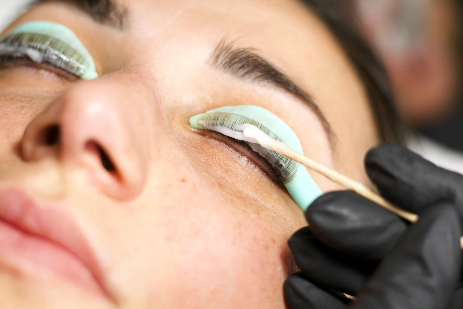 A Woman is Getting Her Eyelashes Done at a Beauty Salon — Xtreme Rejuvenation Clinic, Medispa & Beauty Therapy In Maryborough, QLD