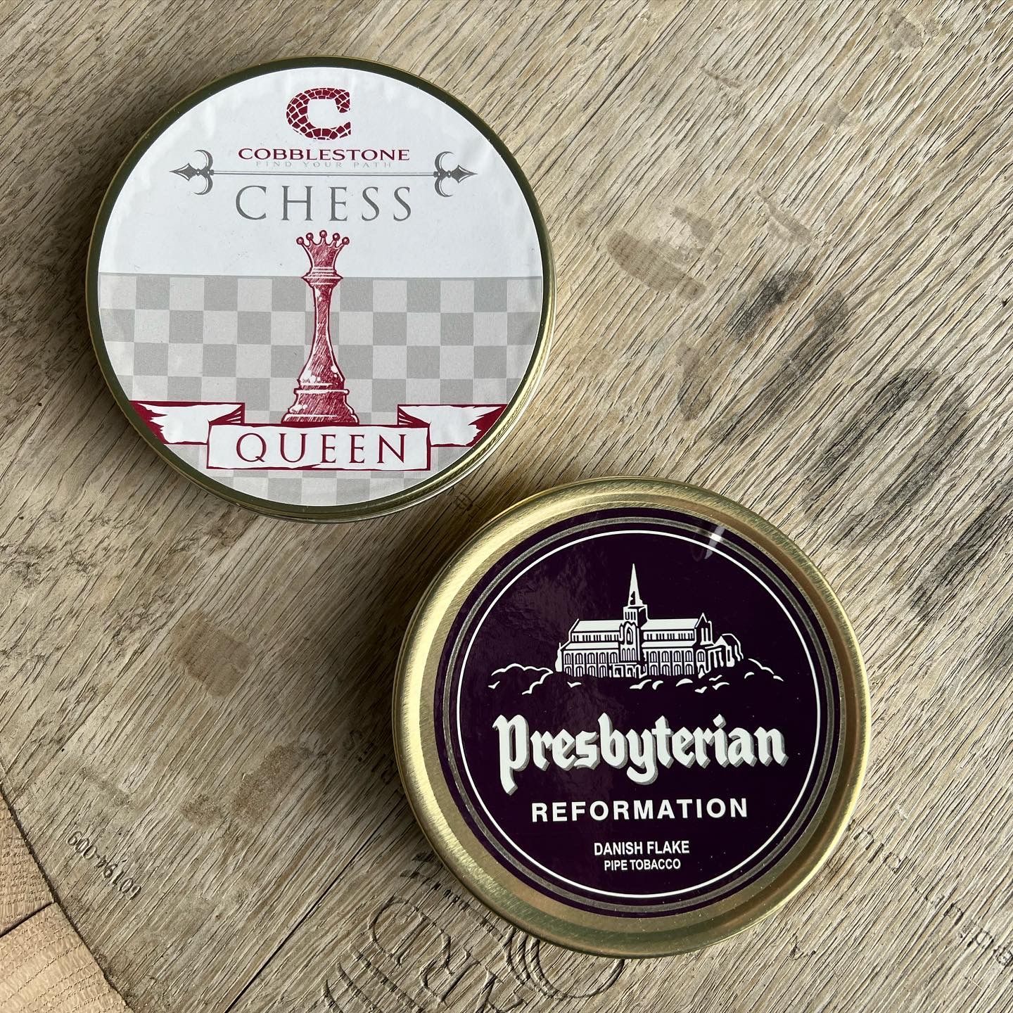 Two cans of tobacco one of which is presbyterian reformation