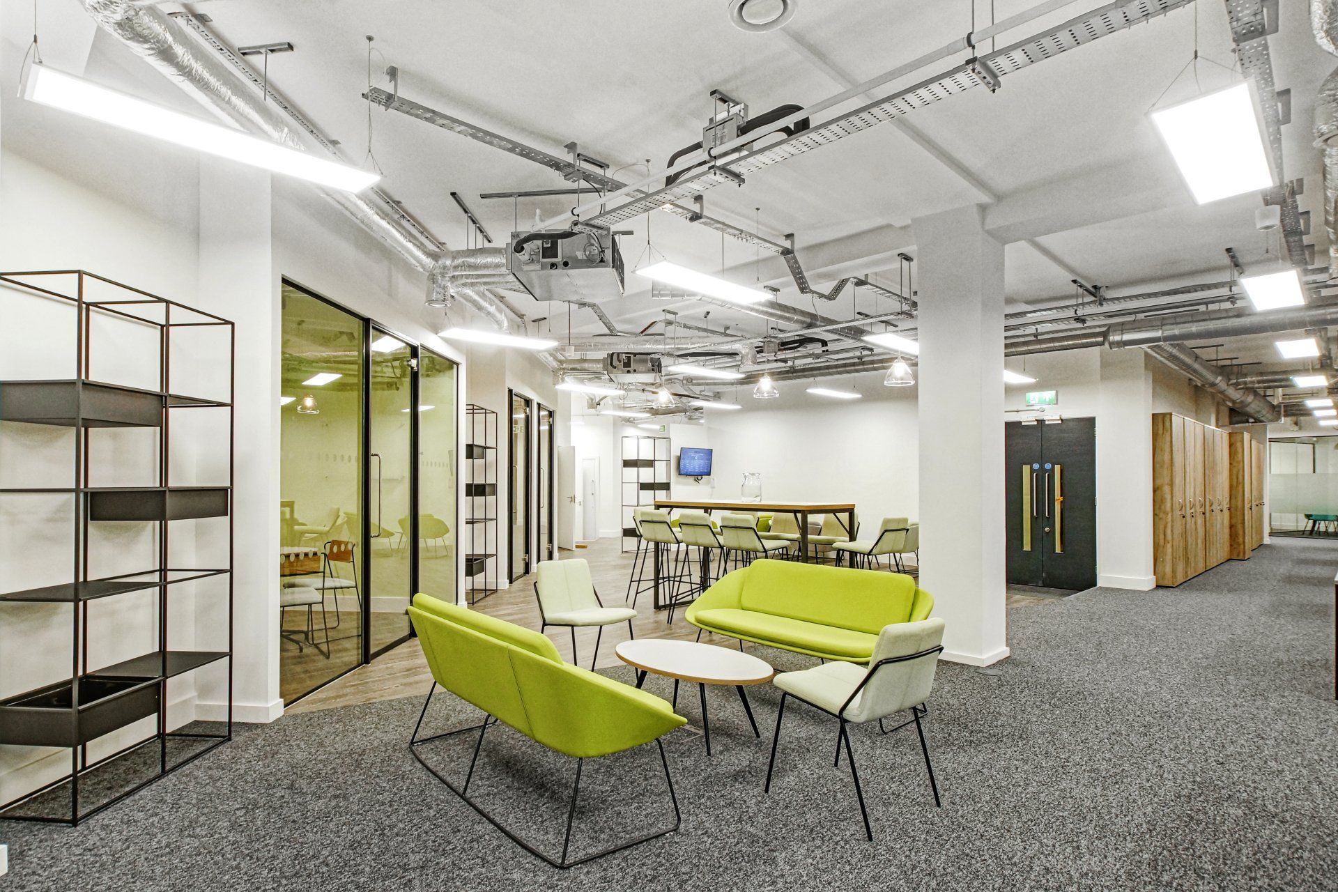 A large room with a lot of furniture and tables.