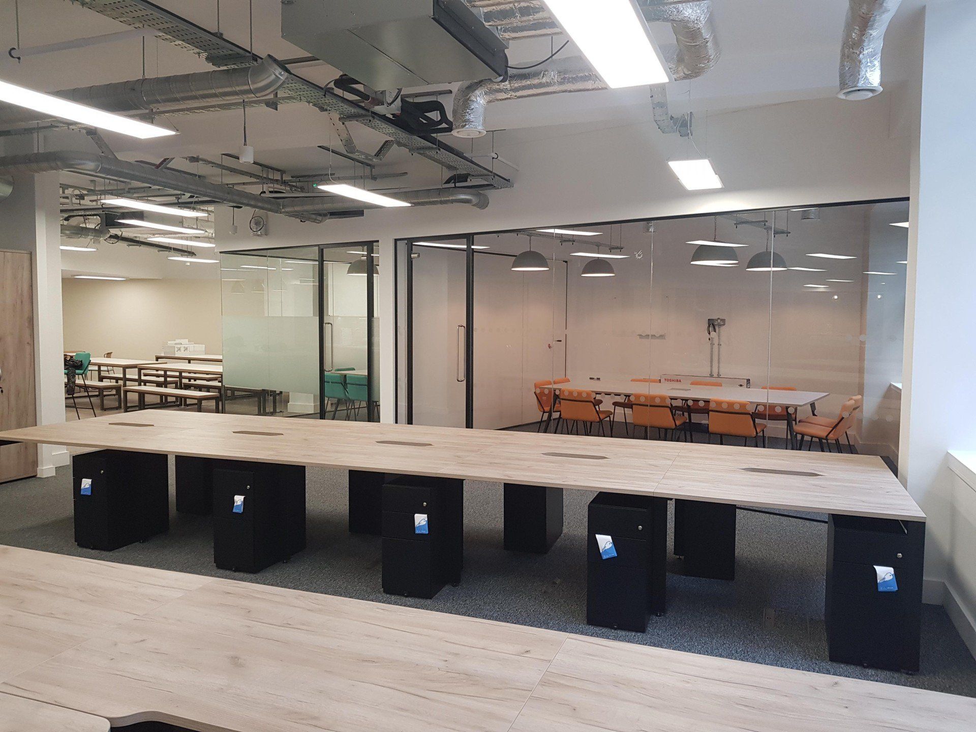 A large room with tables and chairs in it