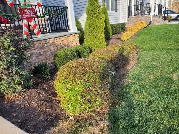 There is a christmas sign on the porch of a house.