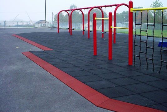 A playground with red bars and a red border