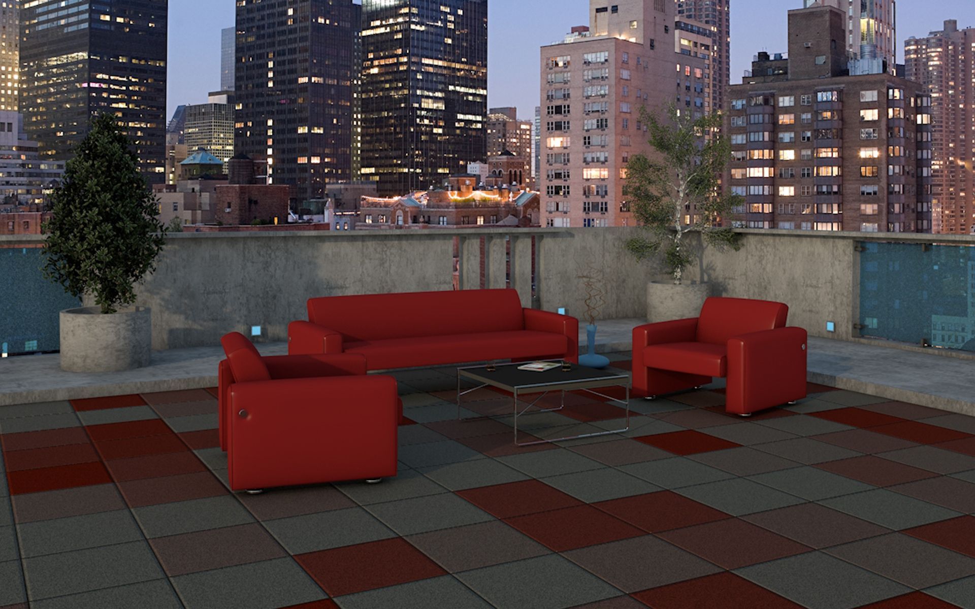 A couch and two chairs on a rooftop with a city in the background