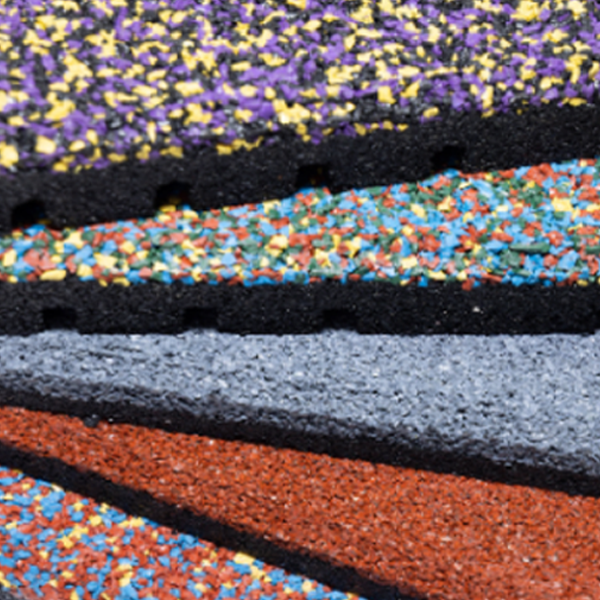 A close up of a stack of colorful rubber mats.