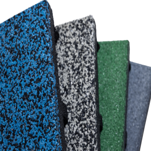 Four different colored rubber tiles are stacked on top of each other