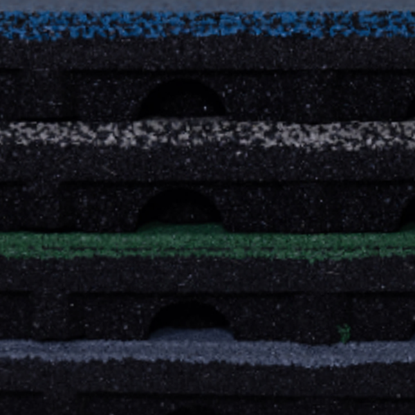 A close up of a stack of rubber mats.