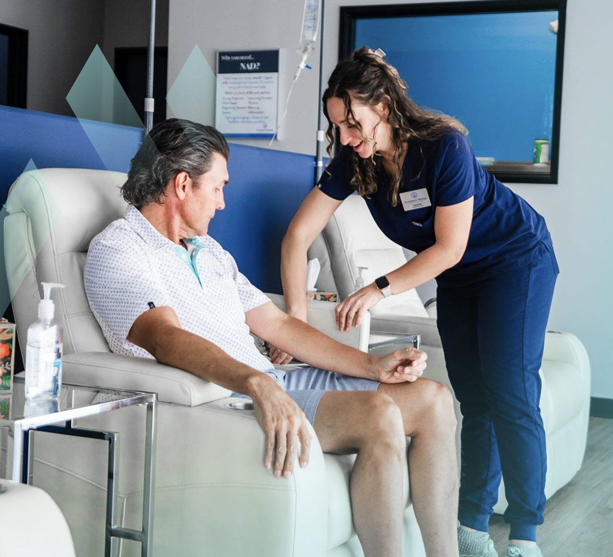 Business Traveler Receiving Mobile IV Therapy for Jet Lag Recovery at Hotel