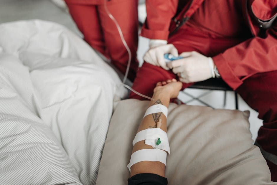 Licensed professional monitoring an NAD+ IV drip in a home setting - NAD+ IV Therapy: Benefits, Cost…