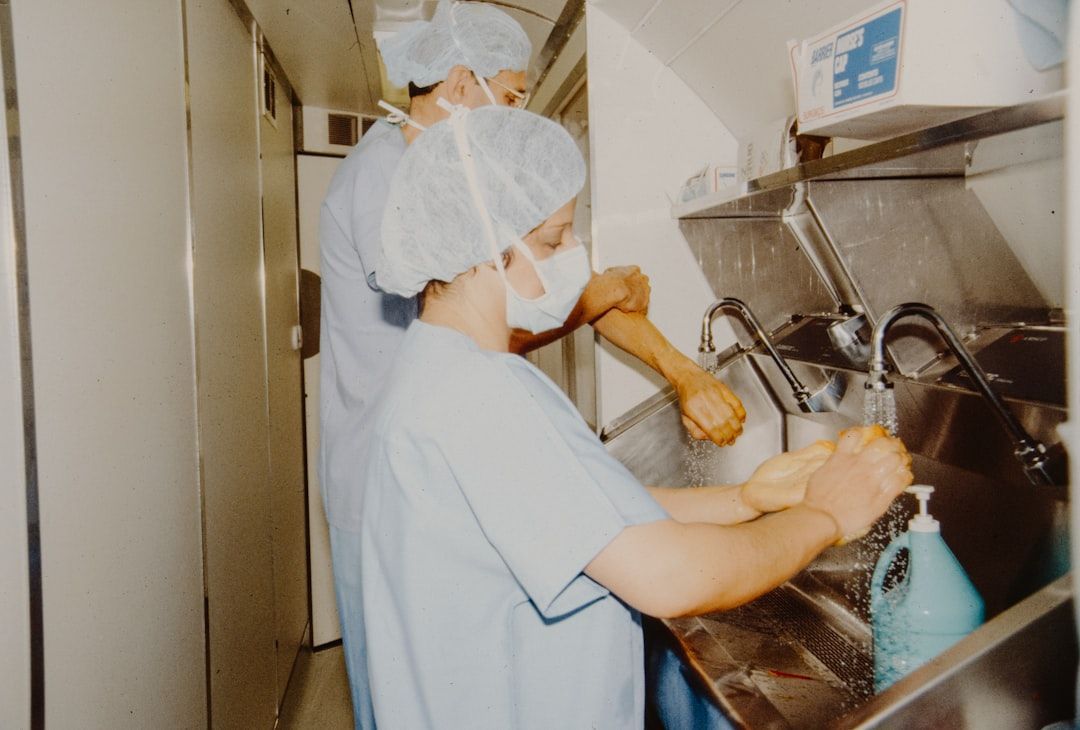 medical professional preparing an IV bag - iv house calls