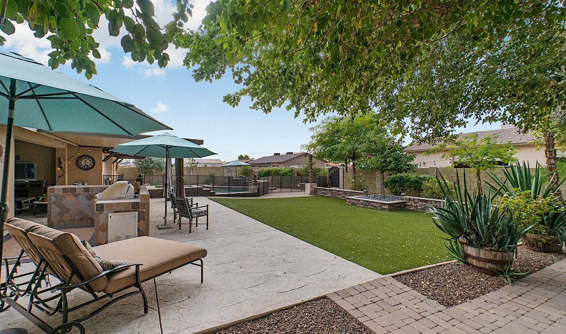 Concrete patio surrounded by beautiful landscape in Denver, CO.