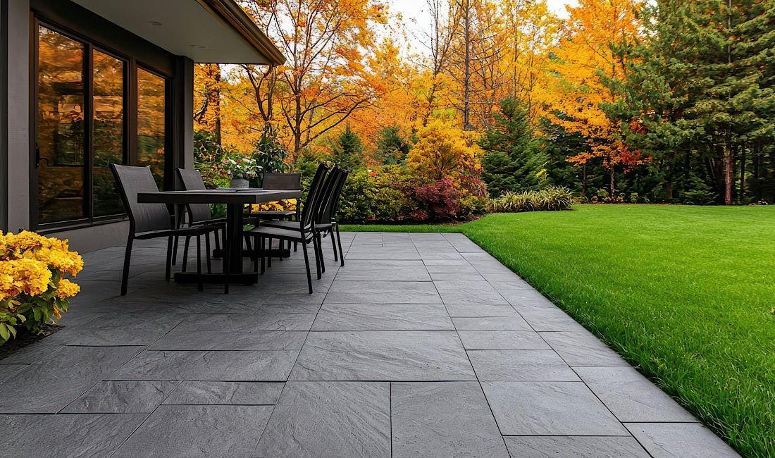 Beautiful concrete patio surrounded by autumn trees and landscape in Denver, CO.