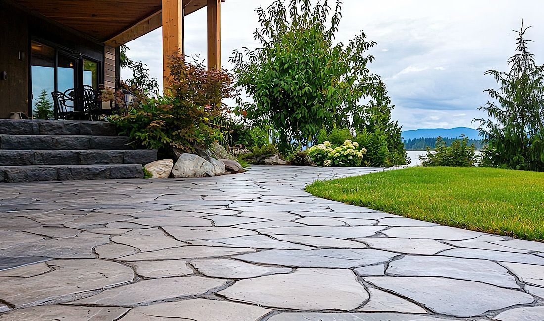 Beautiful stamped concrete patio overlooking the mountains and lake. Perfect for entertaining.