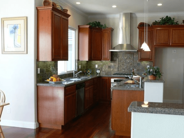 Kitchen with custom stone counter tops and wood custom cabinets