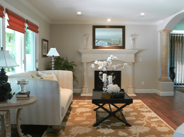 Interior living room with custom stone mantel and fireplace