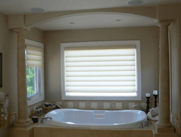 Custom stone column and tile work for a unique quartz bathtub in Santa Clara, CA