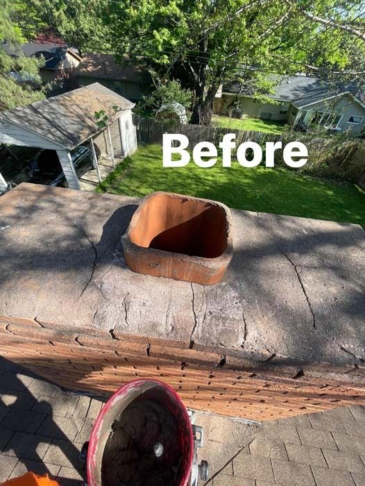 Cracked chimney before repair; a clay flue liner visible. View from above.