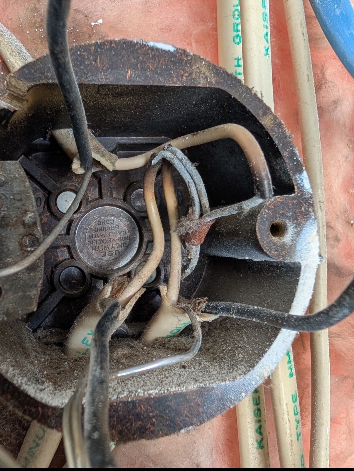 A close up of a metal object with wires coming out of it.