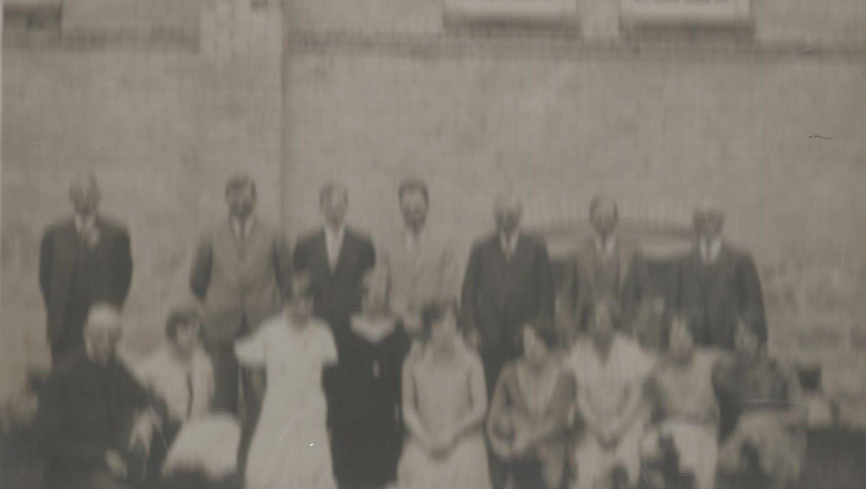This is a very old and blurry photograph of the St. Andrew's Choir in 1932.