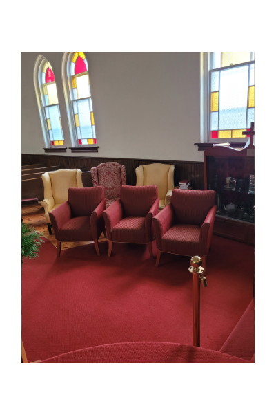 This is a photograph of comfortable seating at the front of the church.