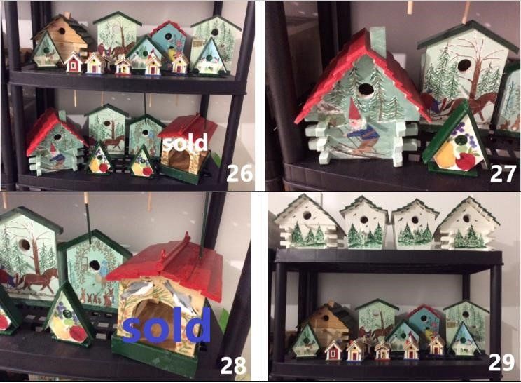 This is a photograph of several birdhouses for sale.