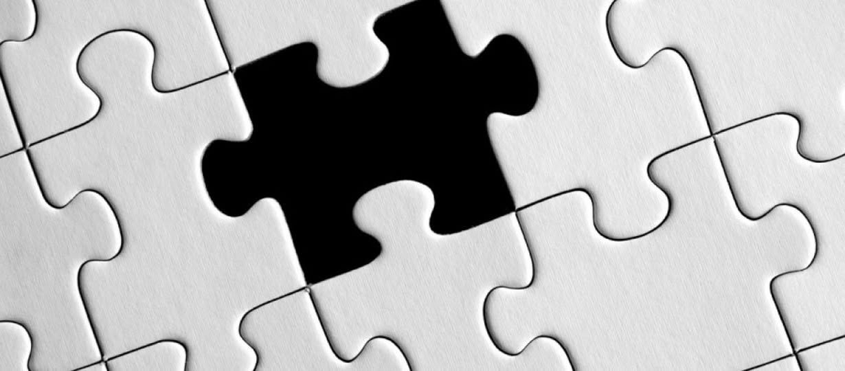 This is a photograph of a puzzle with a piece missing.