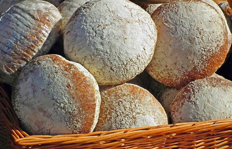 This is a photograph of a basket of fresh loaves of bread.