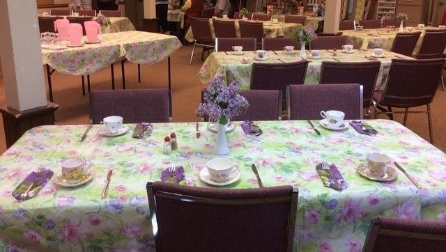 This is a picture of the basement set up for a luncheon.