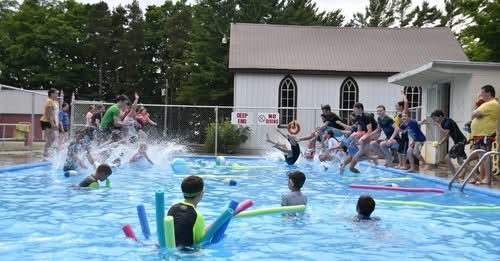 This is an image of kids swimming at Camp Menesetung.