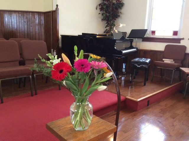 This is a photograph of the pulpit with our grand piano behind it.