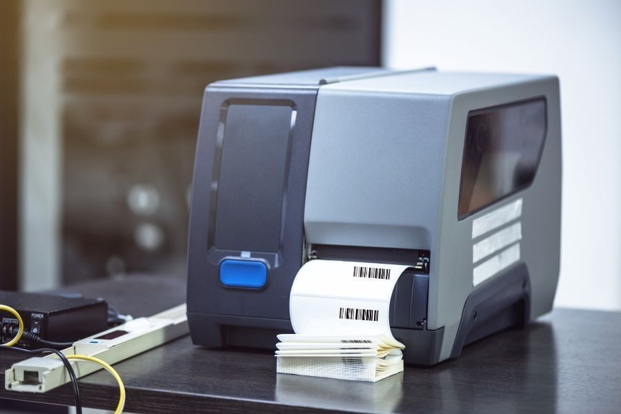 Printer on desk printing barcodes