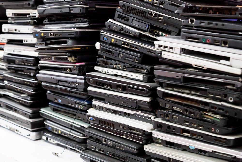 stacks of refurbished laptops