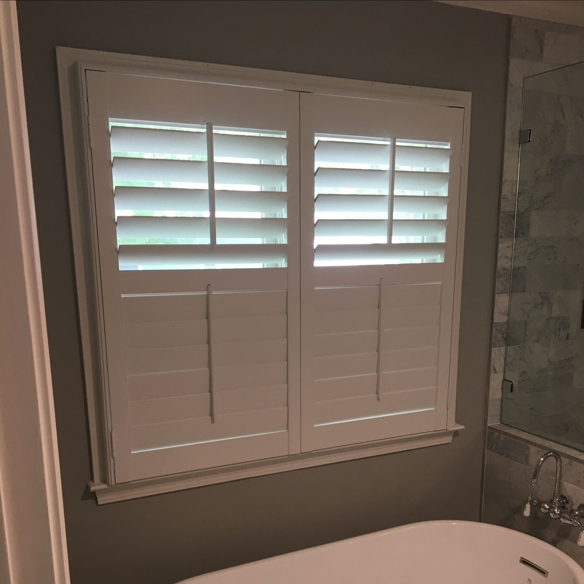 A window with shutters on it