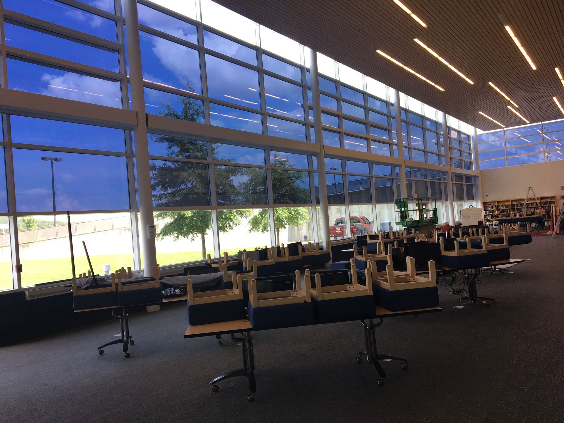 A large room with a lot of windows and tables
