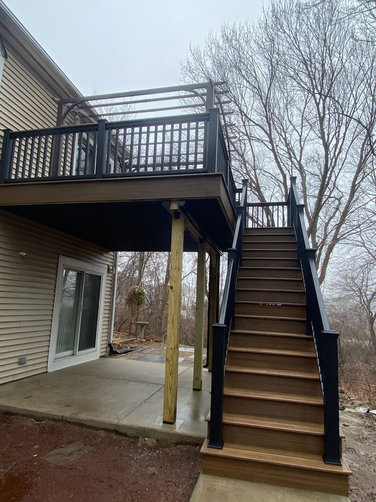 A wooden deck with stairs leading up to it