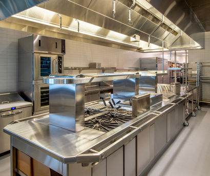A large kitchen with a lot of stainless steel appliances