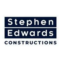 The logo for stephen edwards constructions is blue and white.