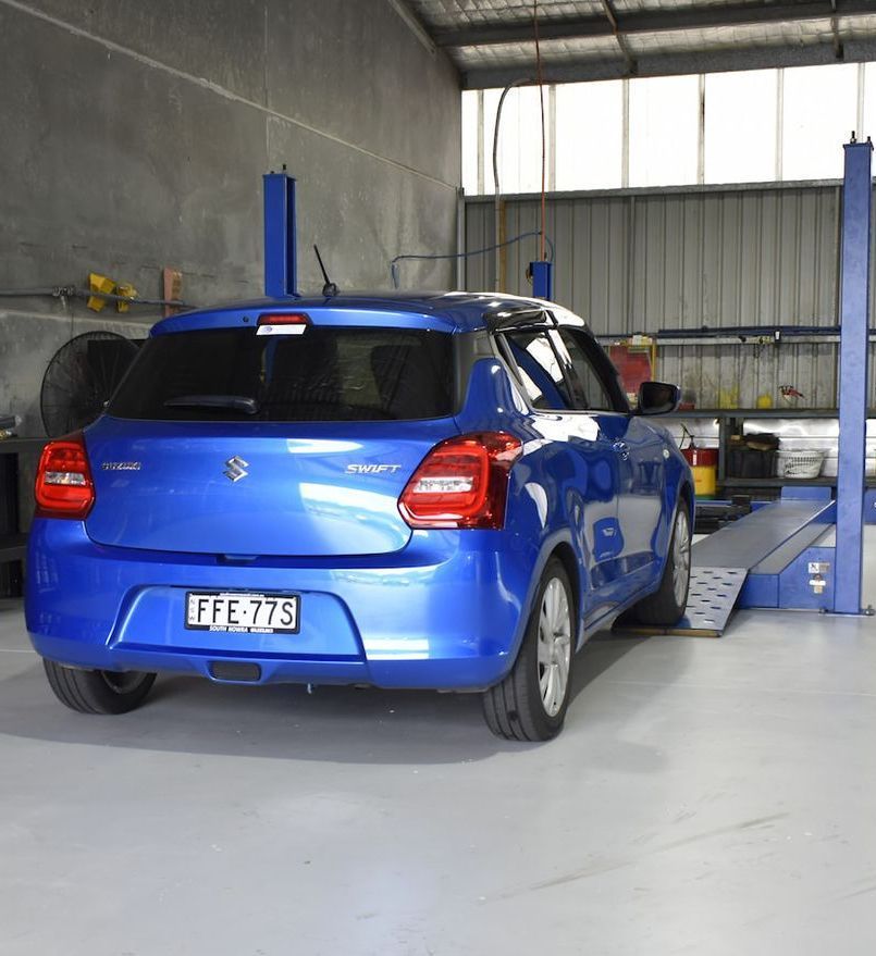 Blue Car In A Mechanic Garage — Optimum Automotive & Road Service In Nowra, NSW