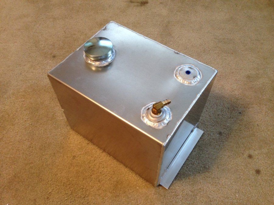 A stainless steel box with two knobs on it