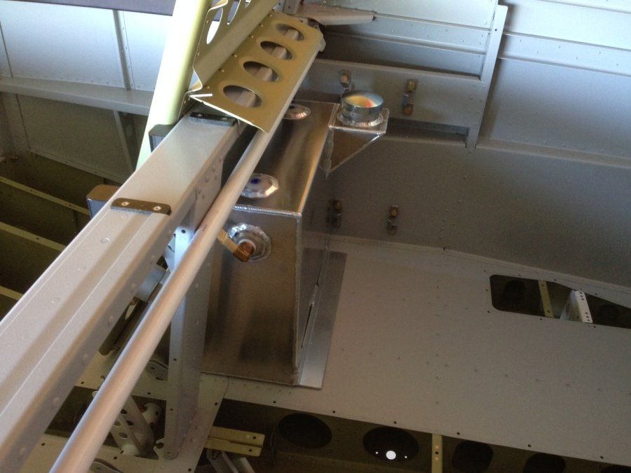 A metal beam with holes in it is attached to a wall